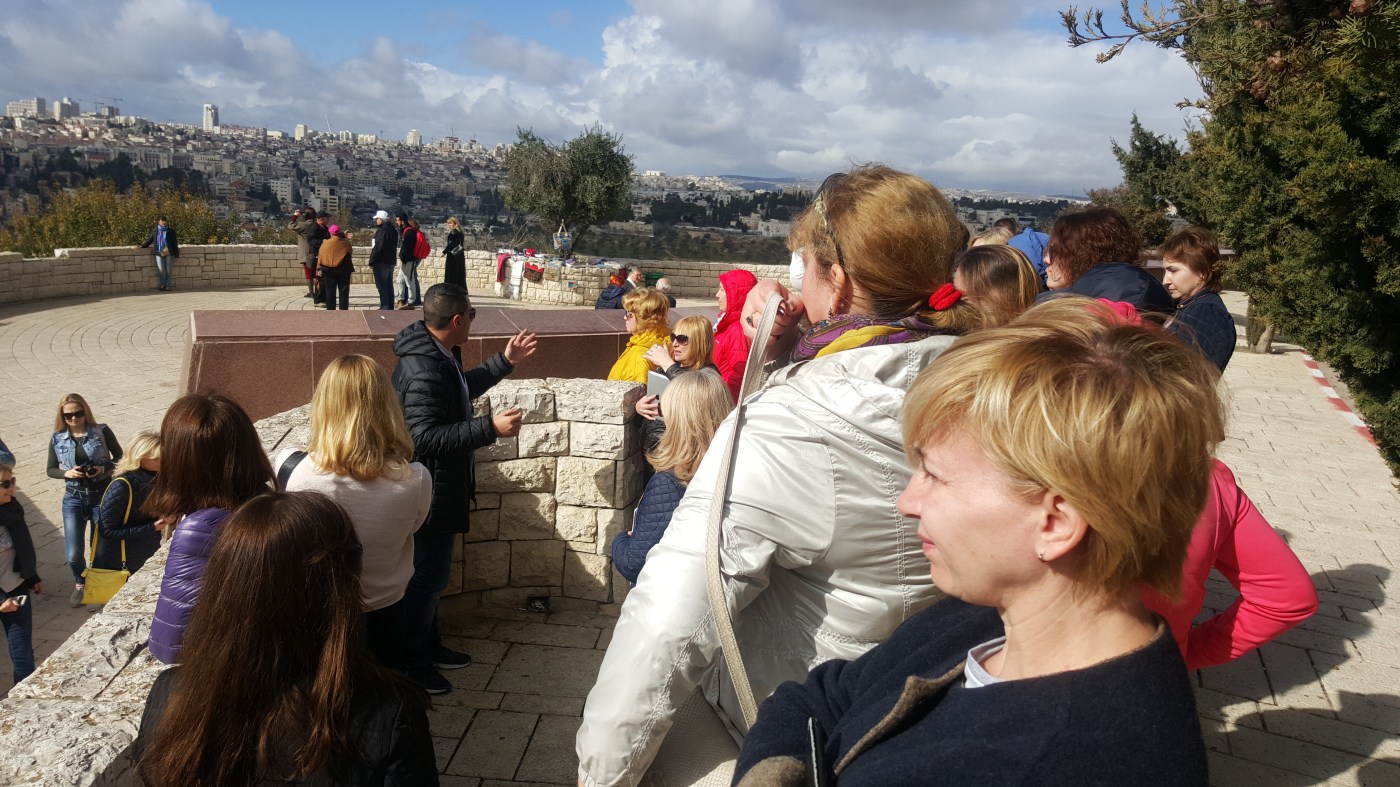 Visitors at a viewpoint overlooking Jerusalem